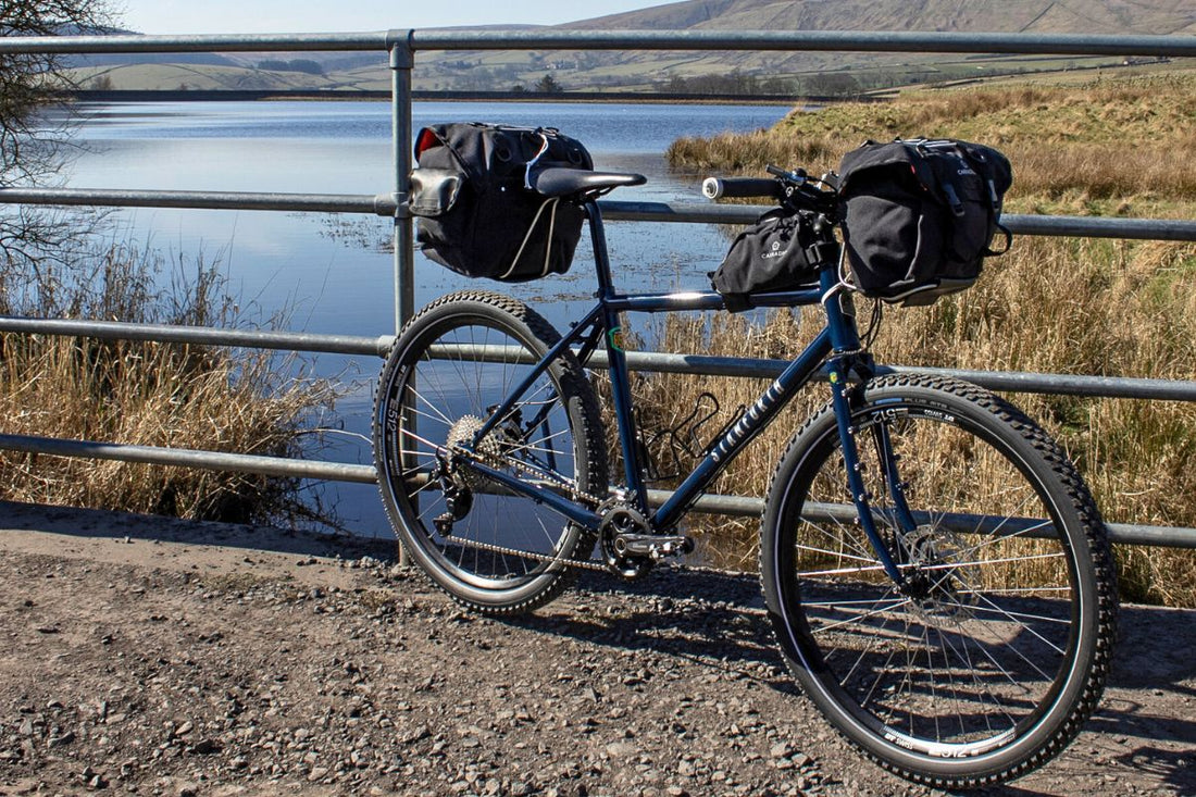 Bike leaning again fence with water in background